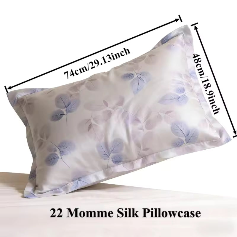 Dimension diagram for a 22 Momme silk pillowcase with a purple leaf print.